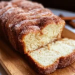 Cinnamon Sugar Donut Bread topped with cinnamon and sugar in a loaf