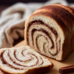 Freshly baked Cinnamon Swirl Bread with cinnamon and sugar topping