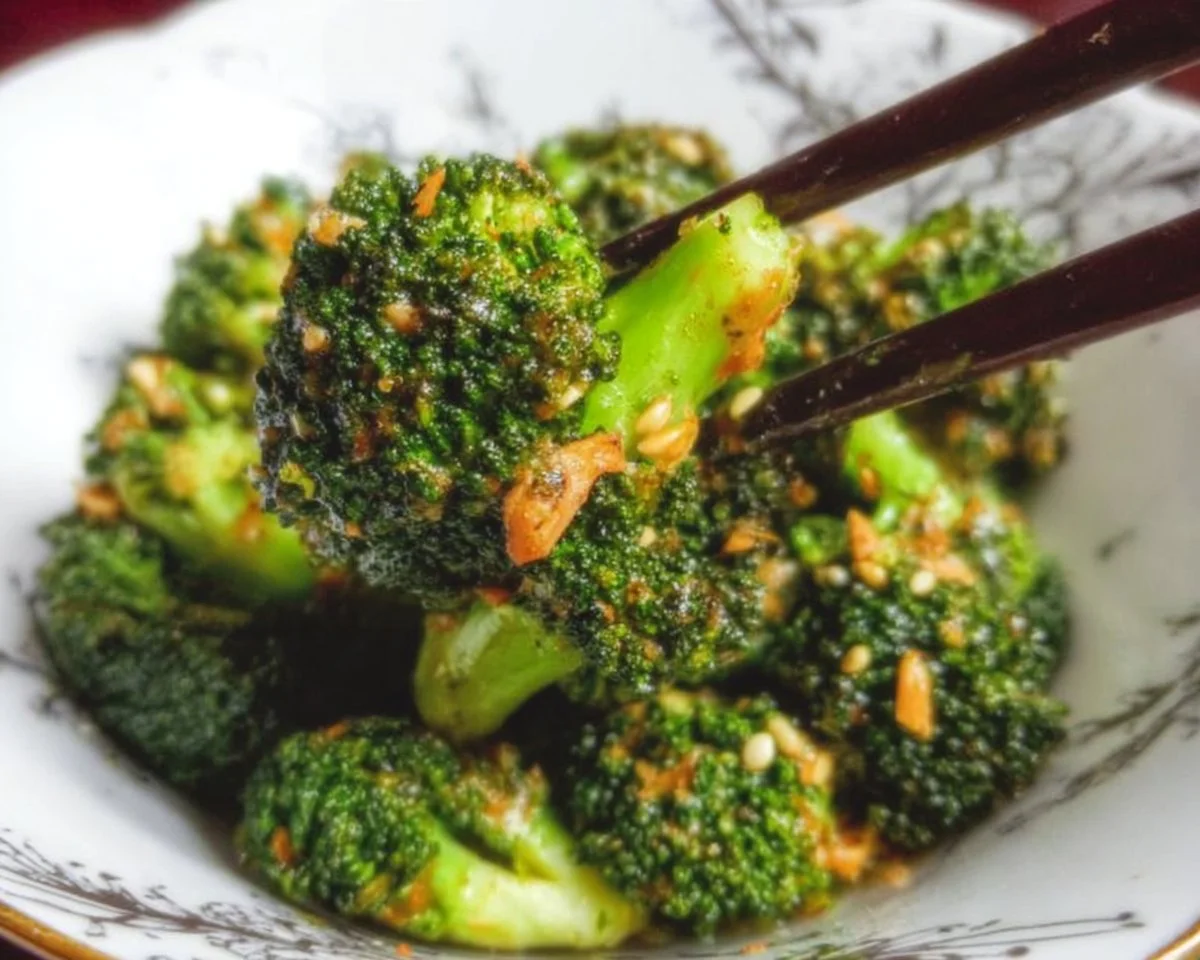 Plate of easy and delicious broccoli with garlic sauce garnished with herbs