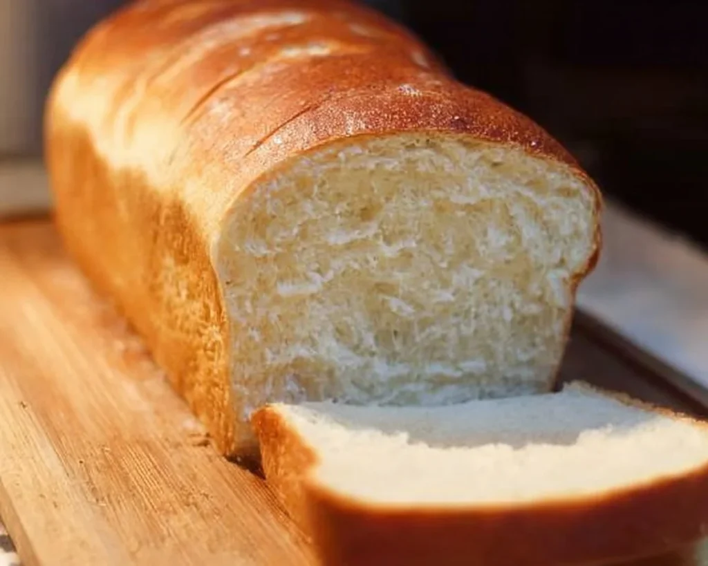 Freshly baked homemade bread loaf on a wooden table