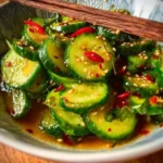 Fresh Asian cucumber salad with sesame dressing and vegetables