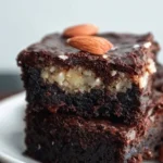 Keto Almond Joy Brownies topped with chocolate and coconut for a low-carb treat