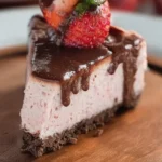 Delicious Keto Chocolate Strawberry Cheesecake topped with fresh strawberries.