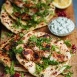 Moroccan chicken flatbreads topped with spices and herbs.