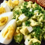 Keto Avocado Egg Salad with avocado and hard-boiled eggs in a bowl