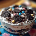 No-Bake Oreo Cookie Casserole dessert with crushed Oreos and creamy layers