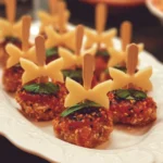 A variety of colorful toothpick appetizers arranged on a platter for a party.