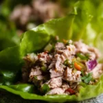 Tuna lettuce wraps filled with fresh vegetables and tuna salad