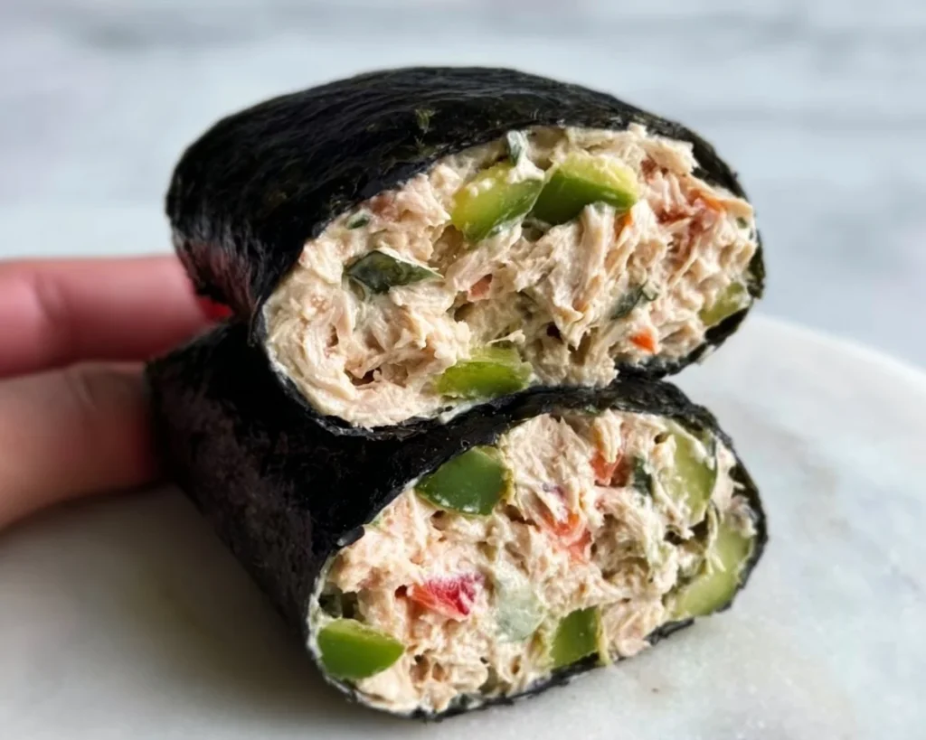 Tuna salad nori wraps served on a plate with fresh vegetables