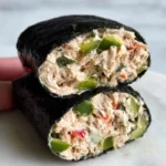 Tuna salad nori wraps served on a plate with fresh vegetables