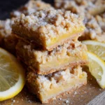 Vegan lemon crumb bars with a crumbly topping and lemon filling