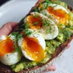 Avocado Pesto Toast topped with eggs, a nutritious and delicious recipe
