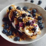 Delicious blueberry crumble banana split dessert with fresh ingredients