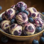 Blueberry Greek yogurt bites with fresh blueberries on a white plate