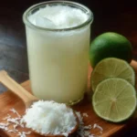 Delicious Brazilian lemonade with coconut in a glass with ice