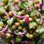 Cucumber Chickpea Salad with red onion and dill in a bowl
