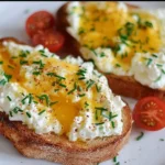 Delicious egg and ricotta toast topped with herbs and spices
