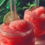 Refreshing watermelon slushies in a glass with mint garnish