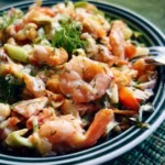 Delicious seafood salad garnished with fresh herbs and vegetables