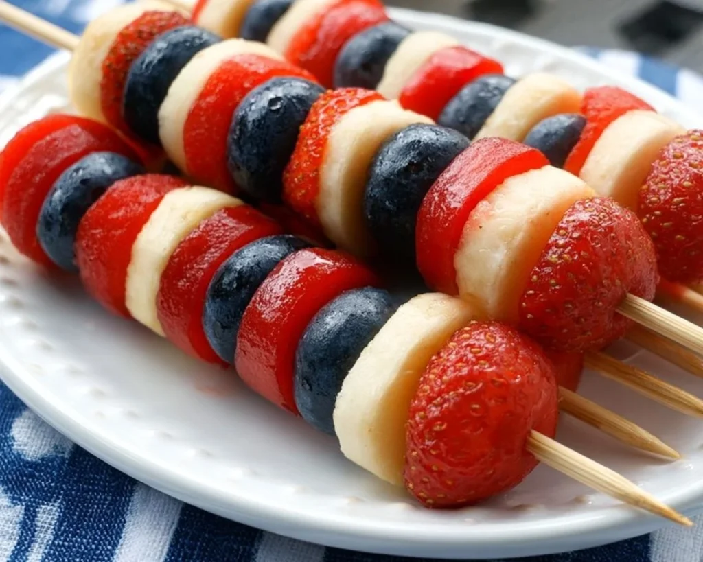 Colorful 4th of July fruit kabobs on a platter