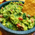 Bowl of authentic guacamole made with fresh avocados and spices