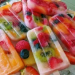 Colorful fruit popsicles made from fresh fruits for a refreshing treat