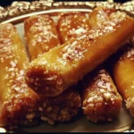 Moroccan Honey Almond Cigars: Sweet honey and almonds wrapped in a delicate pastry.