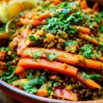 Colorful Moroccan Lentil Carrot Salad served in a bowl with fresh vegetables