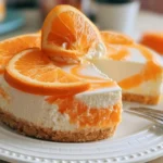 No-bake orange creamsicle cheesecake dessert with vibrant orange topping