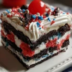Patriotic Oreo Lasagna with red, white, and blue layers for festive celebrations