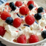 Red, White, and Blue Cheesecake Salad with strawberries, blueberries, and creamy cheesecake dressing
