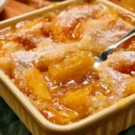 Traditional Old Fashioned Peach Cobbler dessert with fresh peaches