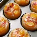 Peach Upside Down Mini Cakes topped with fresh peaches and caramel glaze